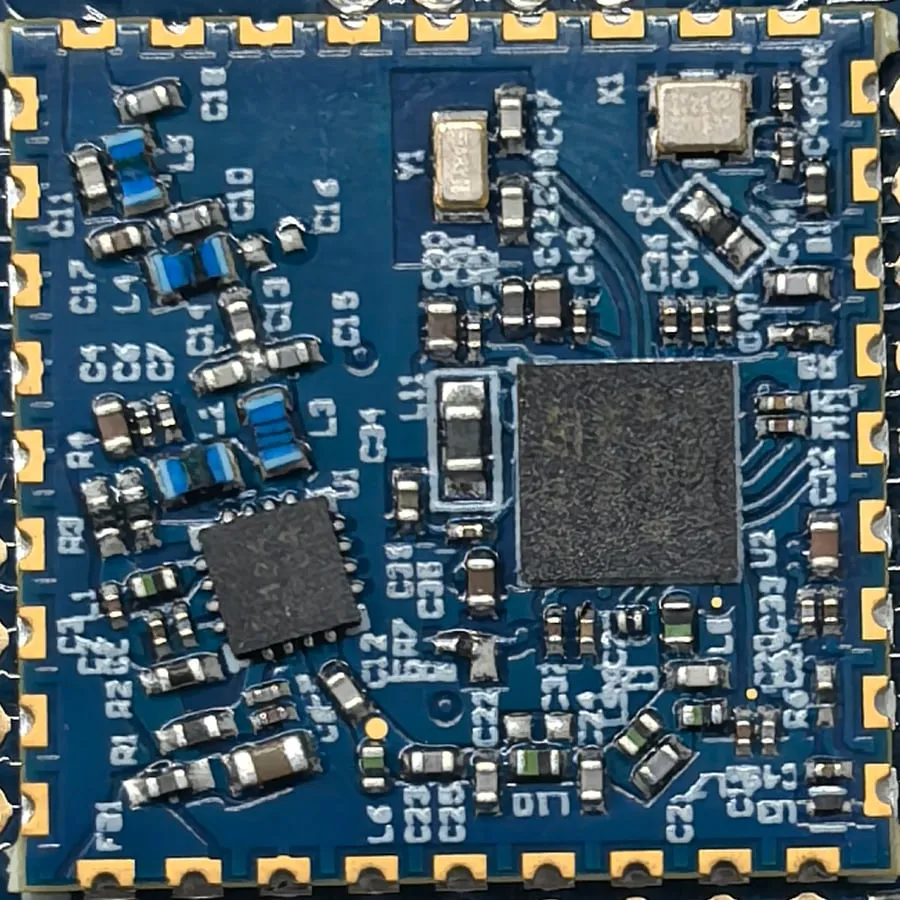 Argos SMD satellite module, 2 × 2 cm, soldered on its host board